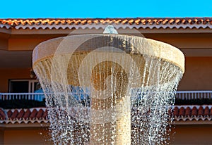 Water fountain in front of house