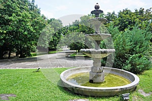 Water Fountain in a huge green garden