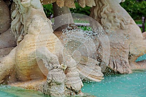 Water fountain in park. Splashing streams of in stream pouring from . on surface lake. in summer .