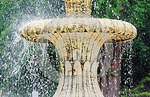 Water fountain in park. Splashing streams of in stream pouring from . on surface lake. in summer .