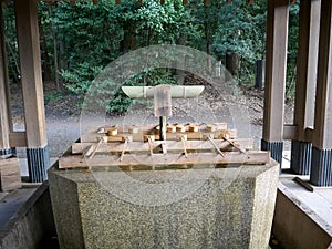 Water fountain for ritual purification at meiji jingu shrine in tokyo