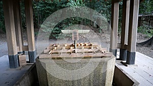 water fountain for ritual purification at meiji jingu shrine in tokyo