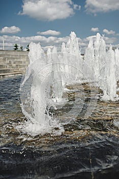 Water fountain water jet over blue sky/Head of water jets from fountain over blue sky