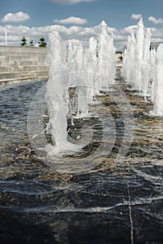 Water fountain water jet over blue sky/Head of water jets from fountain over blue sky