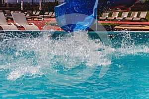 Water fun in the pool, slide. Concept, cheerful, perky bright colorful summer and relaxation. View from above