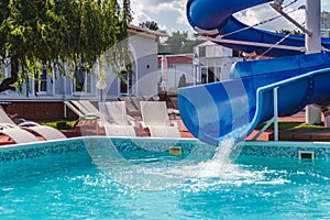 Water fun in the pool, slide. Concept, cheerful, perky bright colorful summer and relaxation. View from above