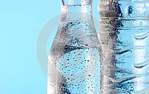 Water in glass and plastic bottles