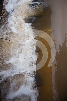 Water gushing out of drains quickly into the canal countryside