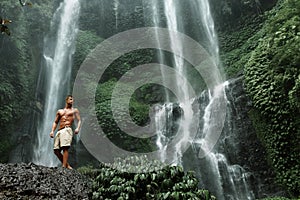 Water. Healthy Man With Body Near Waterfall. Healthcare