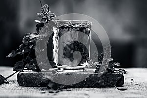 Water of holy basil, tulsi or Ocimum tenuiflorum in a transparent glass.