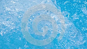 Water in hot tub. Sparkling gushing bright blue transparent water in hot tub or swimming pool. Slow motion full HD