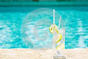 Water with ice at the edge of a resort pool. Concept of luxury v