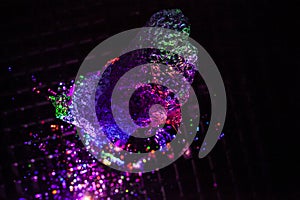 The water is illuminated with colored LEDs.  Yarkits background with water of different colors.