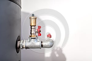 Water installation with tap, pipe connector and safety valve in industrial plumbing