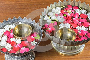 Water with jasmine and roses corolla in bowl