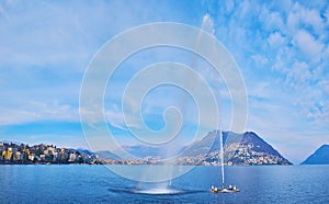 Water Jet on the bay of Lugano fountain, Lake Lugano, Switzerland photo