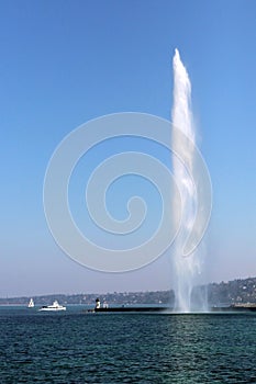 Water jet in Geneva cityscape switzerland. powerful symbol of the city