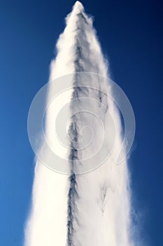 Water jet in Geneva switzerland against deep blue sky