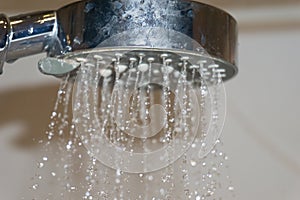 Water jet from a shower head in the bathroom