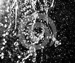 Water jet with spray on a black background