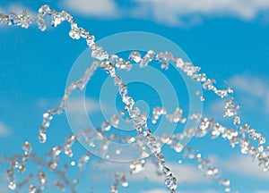 water jet with spray on the sky background