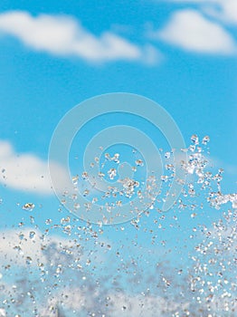 water jet with spray on the sky background