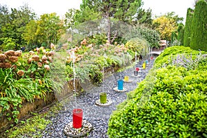 Water Jets in Multi-colored Ceramic Vases in Green Martels Garden
