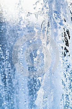 Water jets and a spray of a fountain close up