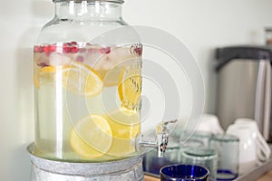 Water jug with water and lemon