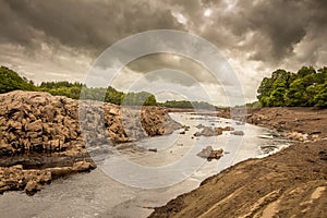 The Water of Ken river in the drained or dewatered Earlstoun Dam and Loch