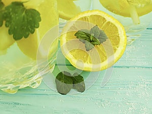 Water soda lemon citrus organic refreshment , freshness homemade health mint summer on a blue wooden background