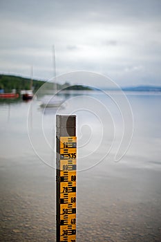 Water level measurement pole at lake Ammersee Bavaria