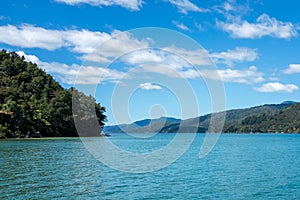 A water level view of the beautiful and stunning Marlborough Sound and the surrounding hills at the top of the South Island, New