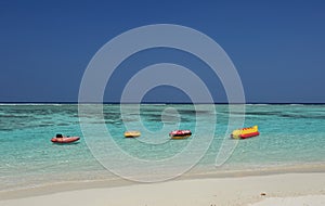 Water and lifesaver in inflated rubber . Inflatable rings in water, concept of the summer timer.Tropical beach at Maldives island