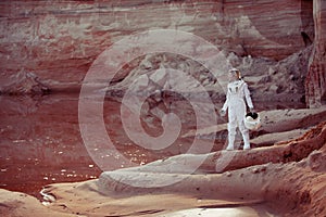 Water on Mars, futuristic astronaut without a