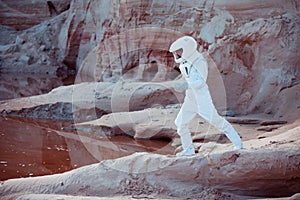 Water on Mars, futuristic astronaut, image with the effect of toning