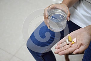 Water and medicines in the hand