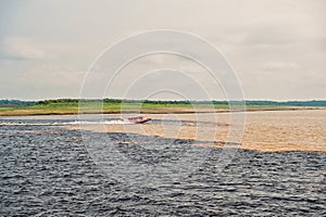 Water meeting in brazil -amazon river with rio del negro