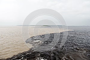 Water meeting in brazil -amazon river with rio del negro