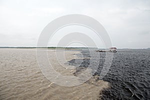 Water meeting in brazil -amazon river with rio del negro