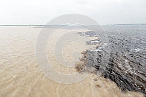 Water meeting in brazil -amazon river with rio del negro