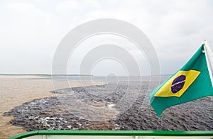 Water meeting in brazil -amazon river with rio del negro