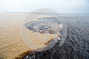 Water meeting in brazil -amazon river with rio del negro