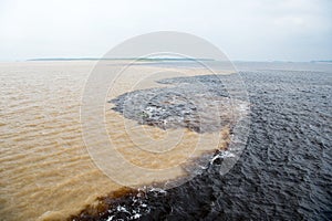 Water meeting in brazil -amazon river with rio del negro