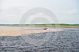 Water meeting in brazil -amazon river with rio del negro