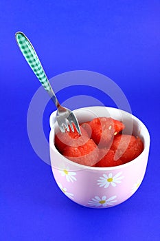 Watermelon balls on blue background