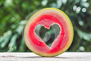 Water melon cut into heart shape. Space for text. Flat lay composition. love concept. Valentine`s Day Concept