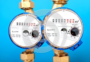 Water meters, sanitary equipment on blue background.