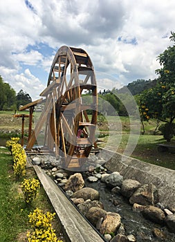 Water Mill at El ParaÃÂ­so Park in Cuenca, Ecuador photo