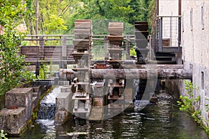 Water mill, hydraulic mill, in the Flambro resurgence water biotope. photo